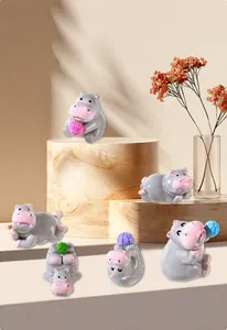 Detail showing six cute gray resin hippo figurines in various playful poses