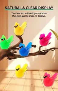 Close-up of colorful resin hummingbird figurines with glossy finish for moss landscapes