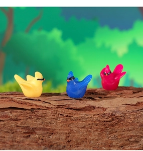 Three colorful resin hummingbird miniatures on tree bark for fairy garden decor