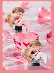 Close-up of cute cartoon couple miniature figurines with matte resin finish