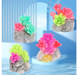 Close-up of colorful resin succulent figurines with realistic grey stone bases