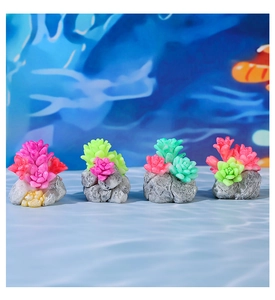 Detailed view of 4 mini succulent resin ornaments on realistic stone bases for terrariums