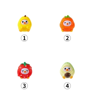 Miniature resin fruit chicks in lemon, orange, strawberry and avocado outfits