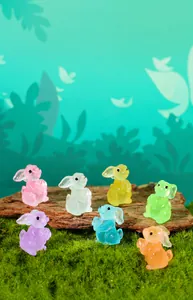 Detailed view of luminous resin rabbit figurines in seven colors for garden decor