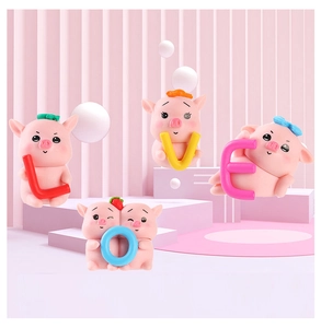 Set of four cute pink resin pig figurines holding letters spelling LOVE for car decor