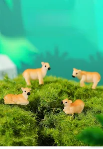 Detailed view of four cute miniature resin cow figurines set in a green moss scene