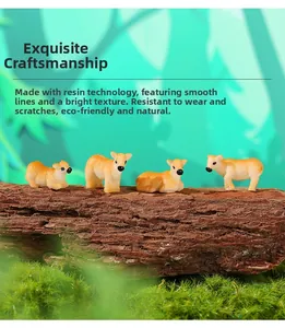 Detail of four miniature resin calf figurines on wood and moss for garden landscaping