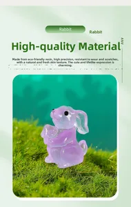 Macro shot of a purple translucent resin rabbit figurine on green decorative moss