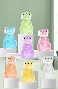 Close-up of translucent colorful resin puppy figurines arranged on white pedestals