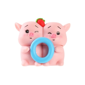 Cute pink pig cartoon resin figurines holding a blue LOVE letter O with strawberry detail