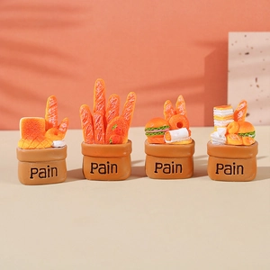 Miniature resin bread basket figurines set with baguettes and croissants in Pain bags