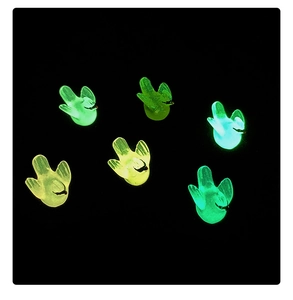 Macro view of six luminous resin hummingbirds glowing in bright green and ice blue colors