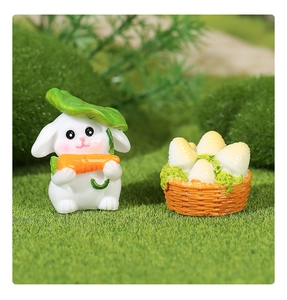 Miniature resin white rabbit figurine holding a carrot umbrella with a basket of vegetables