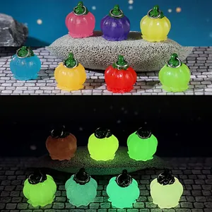 Luminous pumpkin berry garden decor showing glow-in-the-dark effect in various colors