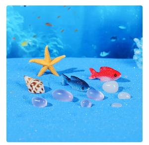 Detailed set of miniature resin starfish, colorful fish, and shells for aquarium decor