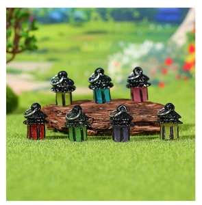 Detailed view of seven colorful miniature resin lanterns for fairy garden landscaping