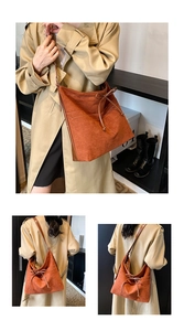 Detail view of caramel brown suede tote bag with elegant decorative bow and reinforced edges