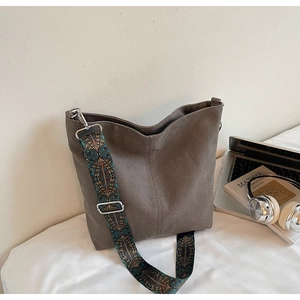 Detail of grey canvas tote bag featuring ethnic geometric pattern wide shoulder strap