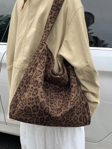 Large leopard print tote bag for women featuring wide straps and spacious canvas interior