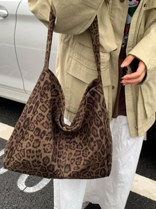 Chic leopard print canvas tote bag for women featuring a spacious interior and shoulder straps