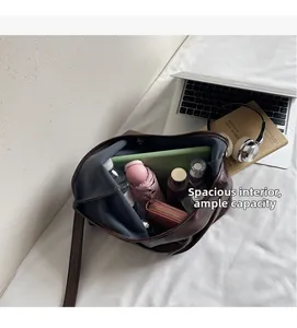 Deep coffee leather tote bag interior showing large capacity for laptop and daily essentials