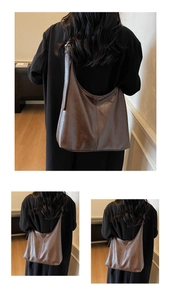 Detailed view of deep brown vintage leather tote bag with soft folds and large capacity