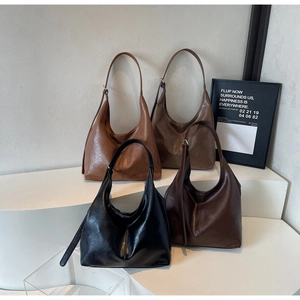 Detailed display of vintage leather hobo bags in black, brown, caramel, and coffee shades
