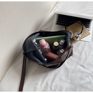 Detail showing the large interior capacity of this soft leather dark brown tote bag