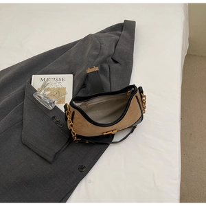 Detail of the interior zip pocket and lining inside the vintage canvas crescent bag