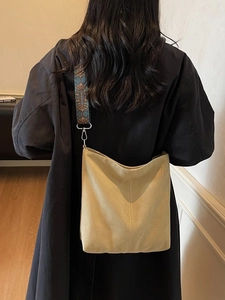Canvas yellow bucket bag with ethnic print wide shoulder strap and silver metal hardware
