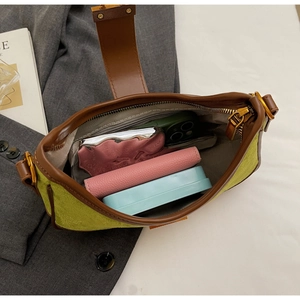 Top view showing the internal capacity of the green and brown retro shoulder bag