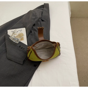 Top view of avocado green suede underarm bag showing interior lining and zipper pocket