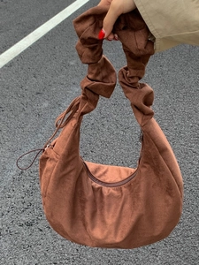 Vintage caramel suede drawstring hobo bag with pleated handle and minimalist design