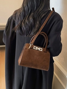 Minimalist large brown suede tote bag with silver lock and shoulder strap for women