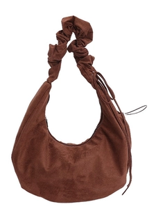 Vintage brown suede hobo bag with a stylish scrunchie strap and drawstring accents