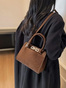 Large dark brown suede tote bag for women featuring silver turn-lock and crossbody strap