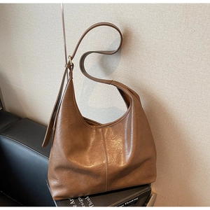 Detail of a brown large Hobo tote bag with vintage embossed soft leather texture