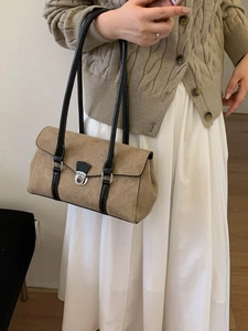 French retro khaki suede baguette bag with contrast black straps and silver metal buckle