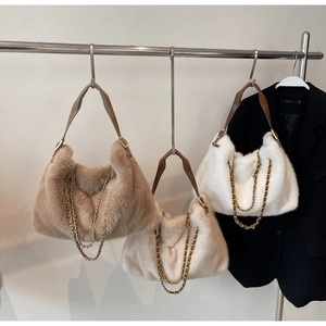 Plush faux fur hobo bags in khaki, off-white, and white with elegant gold chain link detail