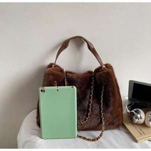 Brown faux fur tote bag showing interior capacity with an iPad for size comparison