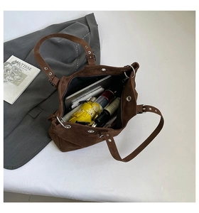 Detail of spacious dark brown suede tote bag showing large capacity for laptop and essentials