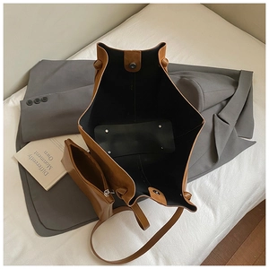 Brown faux leather tote set featuring interior space with matching zip pouch