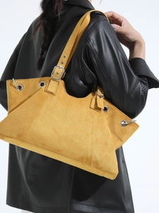 Retro mustard yellow suede tote bag with silver metal eyelets and adjustable strap