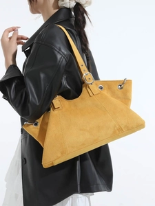 Minimalist large ginger yellow tote bag with metallic eyelets and adjustable strap
