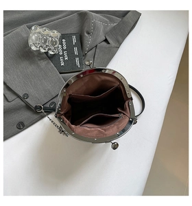 Internal view of black vintage leather bag with brown lining and secure zip pocket