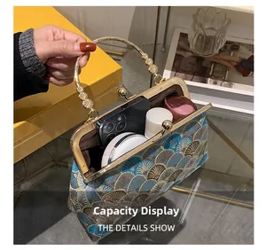Detail view of vintage cheongsam handbag capacity with smartphone and makeup inside