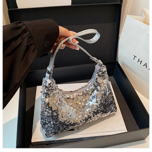 Detailed view of shimmering silver and black sequins on a luxury stylish shoulder bag