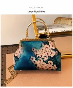 Detailed view of blue floral qipao handbag with gold metal clasp and beaded handle