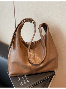 Brown faux leather crescent hobo bag with adjustable strap for daily commute and fashion