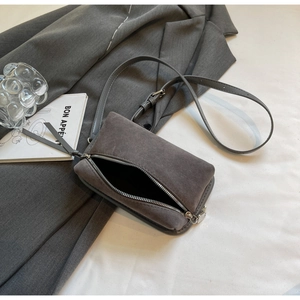 Top view of charcoal grey suede box bag with silver zipper and slim shoulder strap